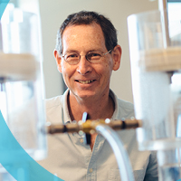 Scientist smiles in his lab